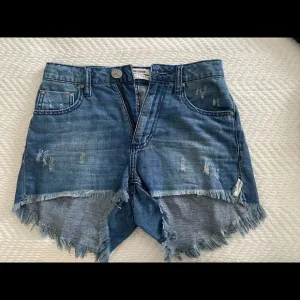 ONE TEASPOON distressed medium wash denim shorts